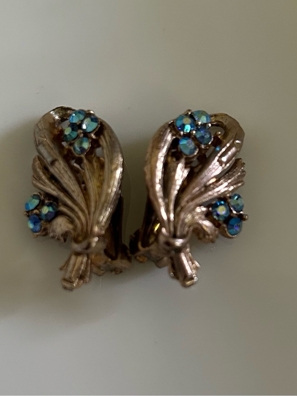 Vintage Gold Tone Floral Clip Earrings with Blue Aurora Borealis Stones
